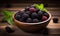 Organic Fresh Black Raspberries Presented in a Bowl, Resting on a Rich Dark Wooden Background