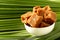 Organic fresh jaggery cubes on palm tree leaf