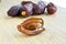 Organic fresh nutritious dried hurma dates medjool grains, on cutting board