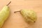 Organic fresh pear Abate, on wooden board