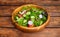 Organic Freshness: Wholesome Salad Bowl on Rustic Wooden Table