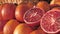 Organic fruits display in a supermarket. Pile of fresh oranges. Slow motion, cinematic slider shot.