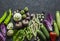 Organic garden vegetables food background. Red cabbage, zucchini, peppers, beets, beans, squashes, garlic on dark background, top