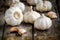 Organic garlics with cloves on a wooden background