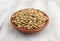 Organic green lentils in a small bowl