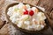 Organic healthy fruit salad Ambrosia with marshmallow and vanilla yogurt close-up. horizontal