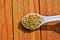 Organic Healthy Millet in a Spoon,Healthy Kodo Millets Close up View ,bajra seed on wooden background