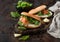 Organic healthy sandwiches with salmon and bagel, cream cheese and wild rocket and lemon with linen towel