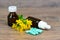 Organic herbal medication in capsules and brown glass bottles