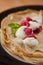 Organic home made Crepes with cream and raspberry