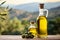 Organic homemade olive oil bottle on blurred defocused background with copy space for text placement