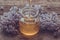 Organic honey pours in a glass jar, wrapped in a spring flower,