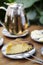 Organic mango cake and herbal tea set on cafe table