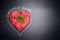 Organic meat for healthy Eating. Heart shape raw meat with herbs and text on black blank chalkboard background