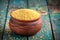 Organic millet seeds in a ceramic bowl