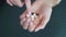 Organic and natural medicines. Pills in the hand of a female young palm. Ginseng, calcium, vitamins and minerals in the