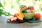 Organic peach on plate and in bowl on rustic table