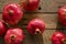 Organic pomegranates on old table