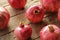 Organic pomegranates on old table