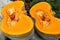 Organic Pumpkin slice for Halloween and Thanksgiving day holiday. Fresh sliced squash for Halloween background. Orange Gourd textu