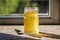 Organic pure honey in jar on window sill