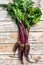 Organic purple beets. Wooden light background. Top view
