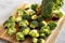 Organic Raw Broccoli Florets on a wooden board, side view