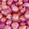 Organic red onions top view, food background