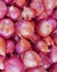 Organic red onions top view, food background
