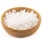 Organic sea white salt tablets in a wooden bowl on white background