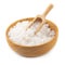 Organic sea white salt tablets in a wooden bowl on white background