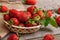 Organic strawberries on a wooden background