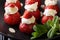 Organic strawberry stuffed with whipped cream, almonds and mint