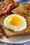 Organic Sunnyside up Egg with toast and bacon