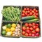 Organic vegetable assortment in basket tomatoes, cucumbers, eggplants, beans