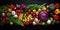 Organic vegetables and fruits table top view over dark background.