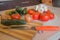 Organic vegetables on table. Backyard vegetables, tomatoes, onion, garlic and cucumber on wooden background. Vegetables from