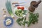 Organic vegetables on table. Include fresh organic vegetables and Cucumber on wooden floor. Green Cucumber, garlic. Summer frame w