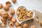 Organic walnuts in the heart on wooden background