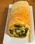 Organic wilted spinach and gorgonzola omelet roll