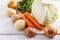 Organic winter vegetables on white wooden table