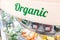 Organic word signage at supermarket vegetable fruits refrigerated aisle section