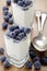 Organic yogurt and blueberries in a square shot glass