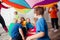 Organised team building games for kids using rainbow canopy