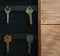 Organize your life, insurance and security concept: vintage opened wooden key holder box cabinet with keys hanging on golden hooks