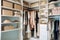 an organized walk-in closet with shelves, drawers, and hooks for storing clothes and accessories