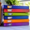 Organized workspace Stack of colorful file folders on office table