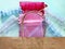 Organza bags and recycled eco bag on blue background