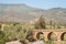 ORGIVA, SPAIN - 16 MAY 2022 The Seven Eyes Bridge over the Guadalfeo river near the tiny mountain village of Orgiva, Spain