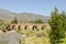 ORGIVA, SPAIN - 16 MAY 2022 The Seven Eyes Bridge over the Guadalfeo river near the tiny mountain village of Orgiva, Spain